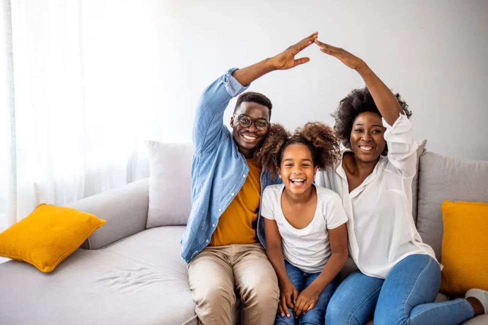 Happy diverse Canadian family at home, illustrating lifelong security and peace of mind with permanent life insurance in Ontario